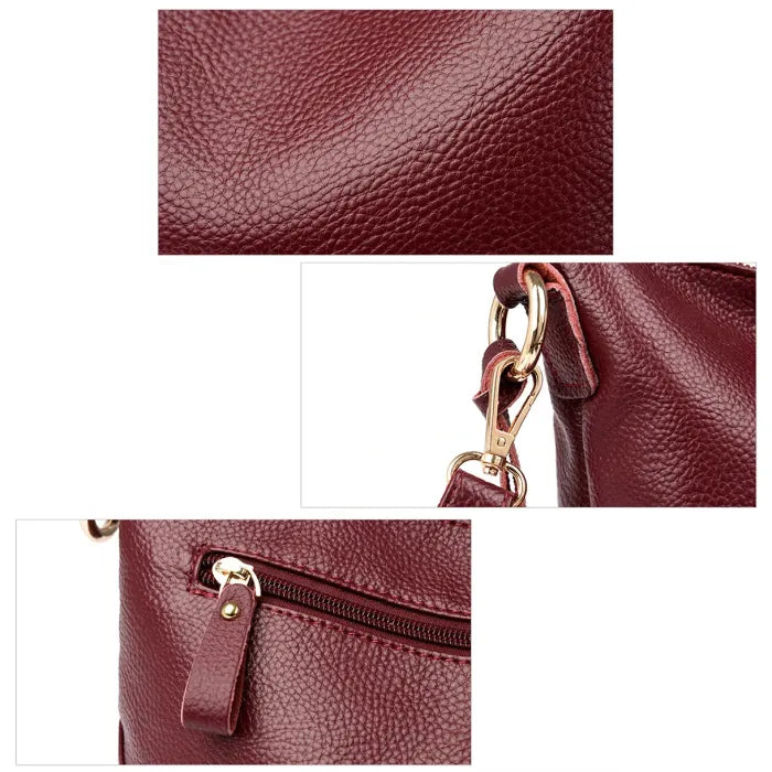 Close-up view of red leather bag showing texture and quality craftsmanship.