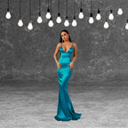 Full view of an elegant teal satin maxi dress featuring spaghetti straps and a floor-length mermaid cut. Shop this backless formal dress today.