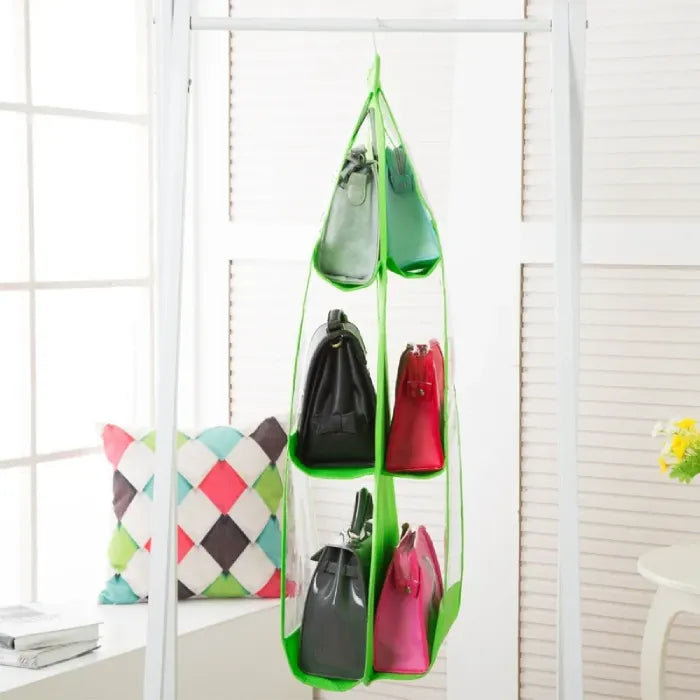 Green hanging organizer with colorful handbags.