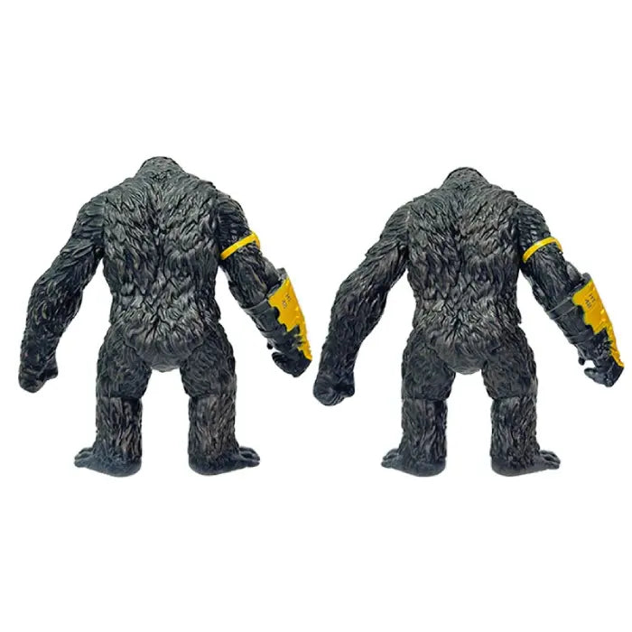 Both king kong action figures with yellow robot arm back view