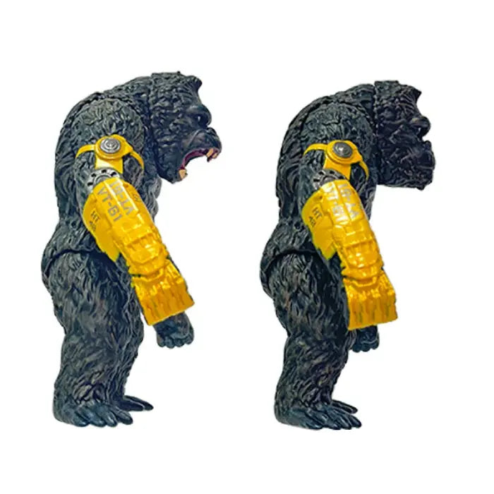 Both king kong action figures with calm and angry face with yellow robot arm right side view