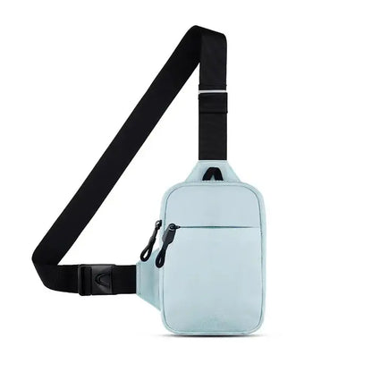 Compact light blue crossbody bag with black adjustable strap, front zippered pocket, and main compartment for everyday use