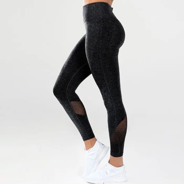 Mesh detail performance leggings in black with compression fit and vented mesh zones for airflow.
