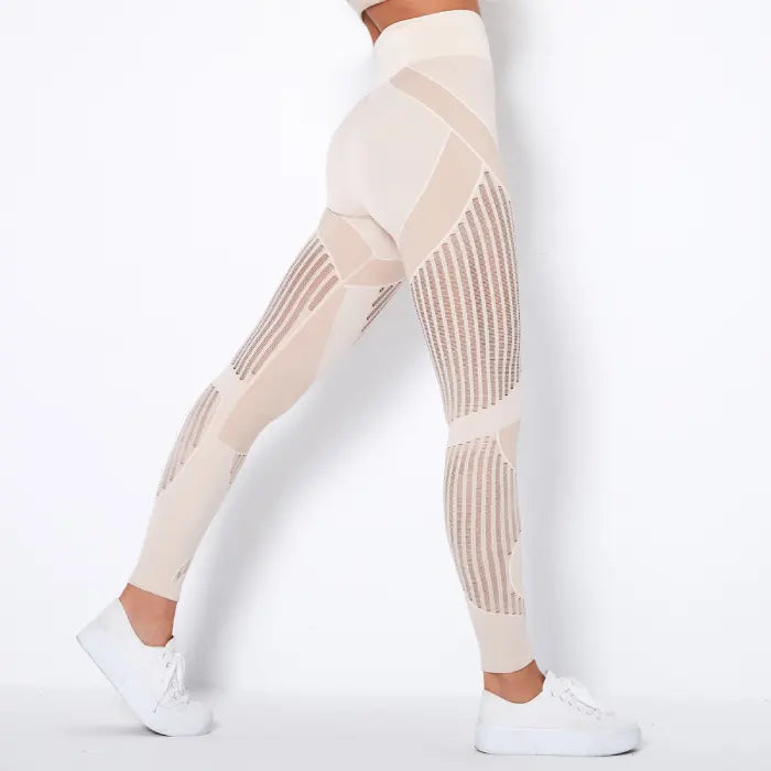 Mesh panel high-waist legging in beige tone with breathable inserts for gym or athleisure wear.