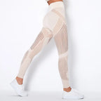 Mesh panel high-waist legging in beige tone with breathable inserts for gym or athleisure wear.