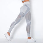 Mesh panel high-waist legging in light gray featuring contour stripes and seamless workout design.