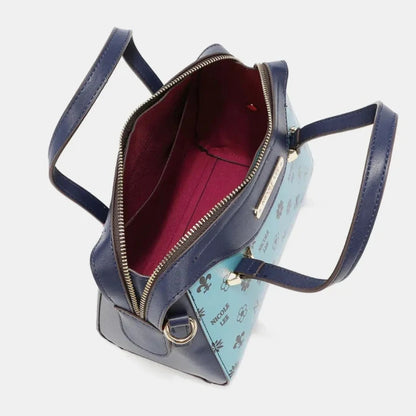 Open Nicole Lee satchel handbag showing burgundy interior lining, zipper closure, and contrasting light blue patterned exterior