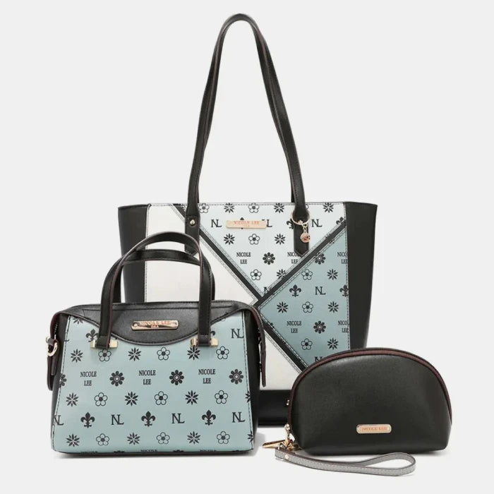 Black, white, and mint green patterned tote bag, satchel, and cosmetic pouch set with floral print