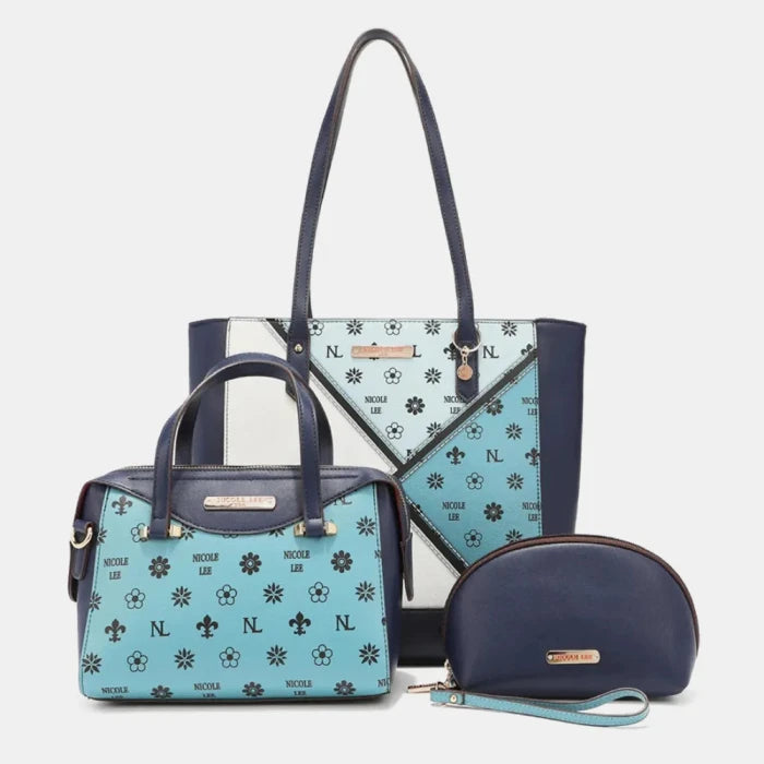 Nicole Lee Navy blue handbag set with floral pattern, including tote, satchel, and cosmetic bag