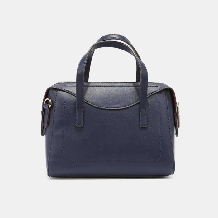 Navy blue leather handbag with double handles and zipper closure