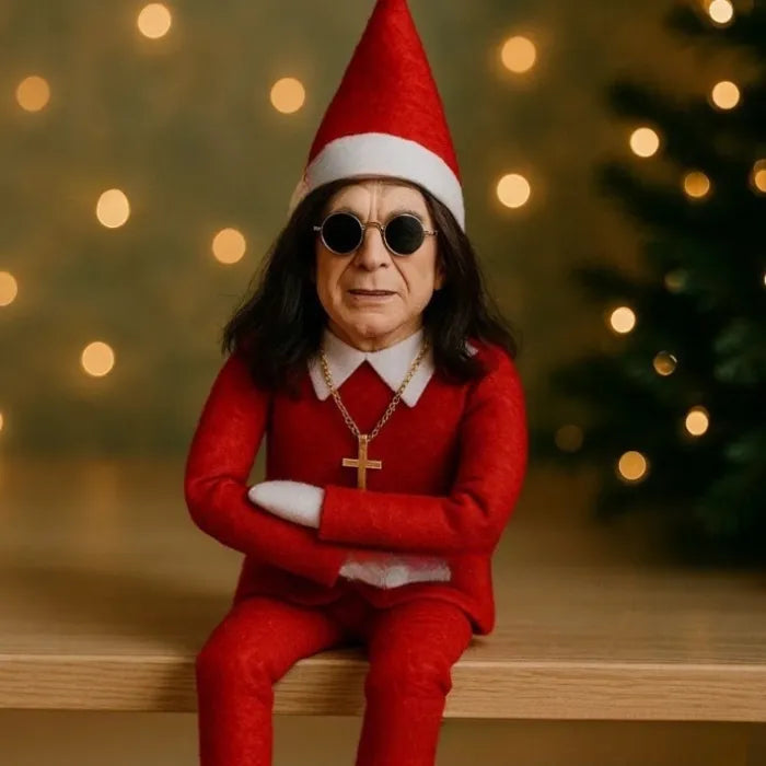 Ozzy Osborne Elf on the shelf doll dressed in red with gold cross and festive bokeh lights backdrop