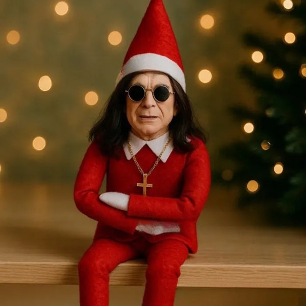 Ozzy Osborne Elf on the shelf doll dressed in red with gold cross and festive bokeh lights backdrop
