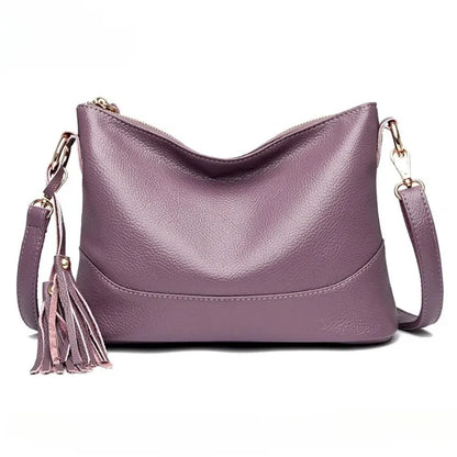 Chic purple genuine leather bag with tassel, ideal for sophisticated looks.