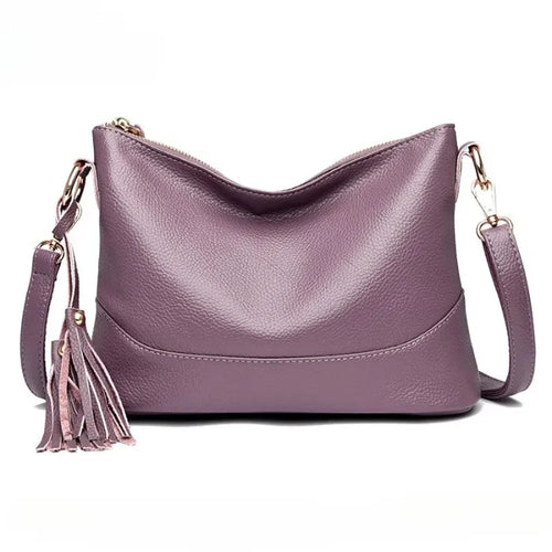 Chic purple genuine leather bag with tassel, ideal for sophisticated looks.