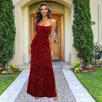 Stunning red sequin prom dress with spaghetti straps, mermaid silhouette and side slit, showcasing all-over sparkle perfect for special occasions.
