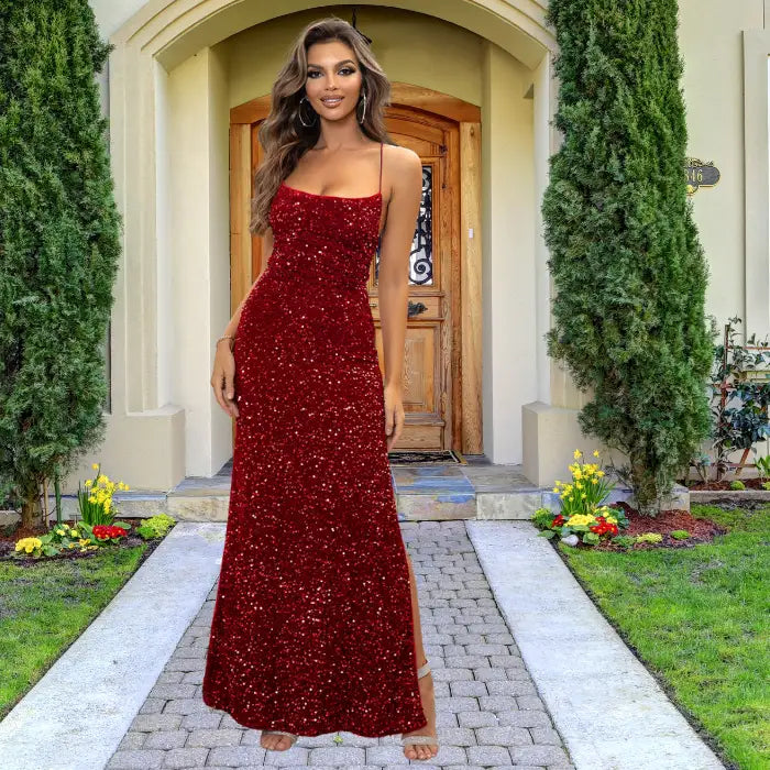 Stunning red sequin prom dress with spaghetti straps, mermaid silhouette and side slit, showcasing all-over sparkle perfect for special occasions.