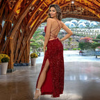 Dazzling red sequin prom dress featuring dramatic open back with crisscross straps, high side slit and form-fitting design for formal events
