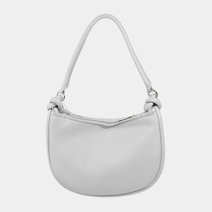 Silver white shoulder bag with knotted handle, smooth leather, and curved silhouette