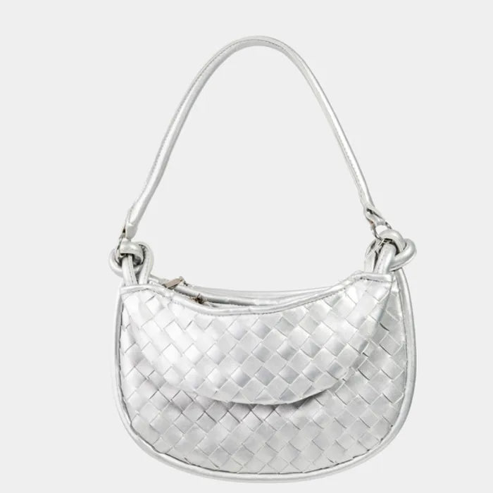 Front view of silver woven leather handbag with knotted handle and curved shape