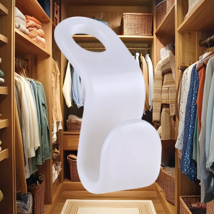 Closet with wooden shelves and clothes, featuring a white lamp in the foreground.