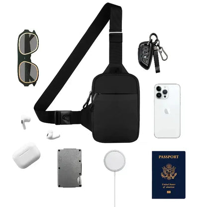 Black sling bag surrounded by travel items including sunglasses, phone, earbuds, passport, and charger on white background