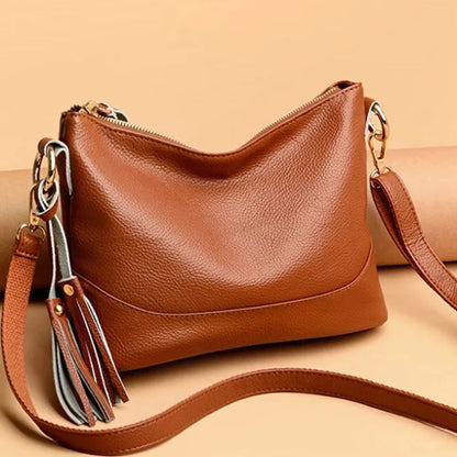 Elegant brown leather handbag with tassel detail. Ideal for stylish women's fashion.