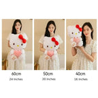 Woman with red lipstick holds large Hello Kitty plush, showing size comparison.