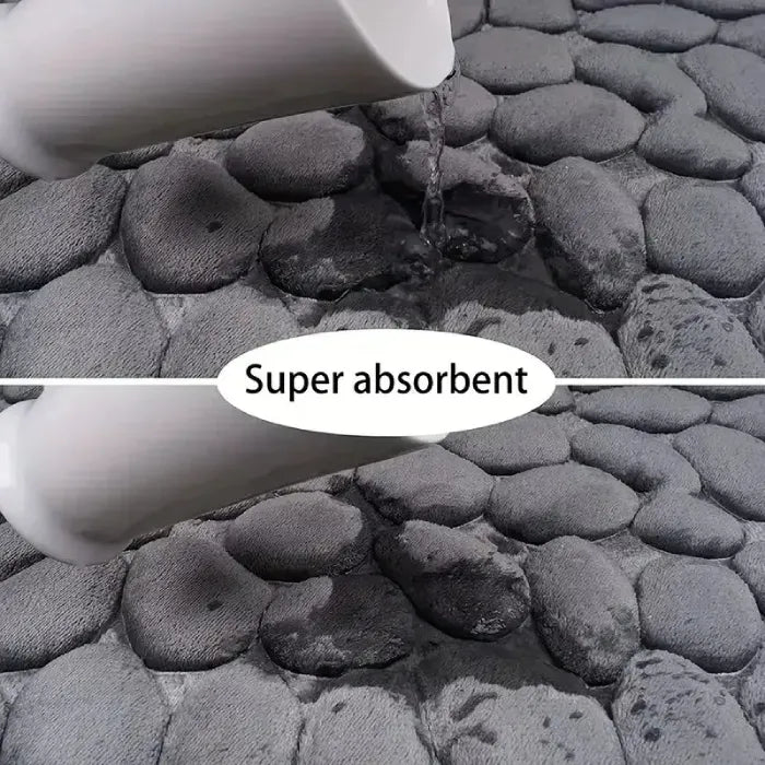 Super absorbent grey mat with water demonstration, perfect for bathrooms.