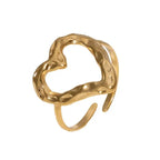adjustable open heart ring in gold with hammered sculpted texture shown isolated, highlighting a classic minimalist modern accessory