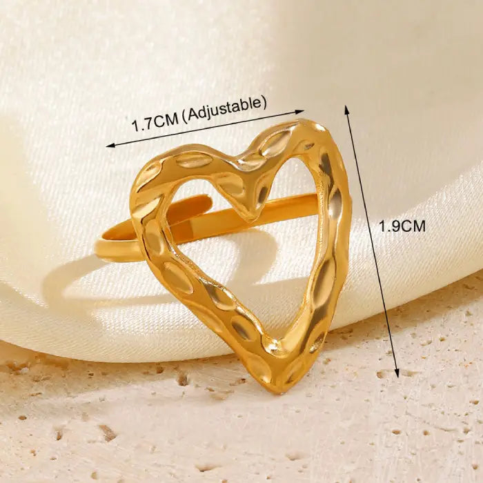 adjustable open heart ring in textured gold shown with size measurements, offering clarity for fit and showcasing a modern sculpted design