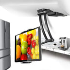 Adjustable tablet stand mounted under a kitchen cabinet holding a large tablet for hands-free recipe viewing while cooking or preparing food