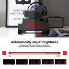 Alarm clock with light sensor that adjusts screen brightness based on room lighting.