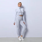 Three-piece seamless yoga set for women in all white, high neck zip jacket and tights.
