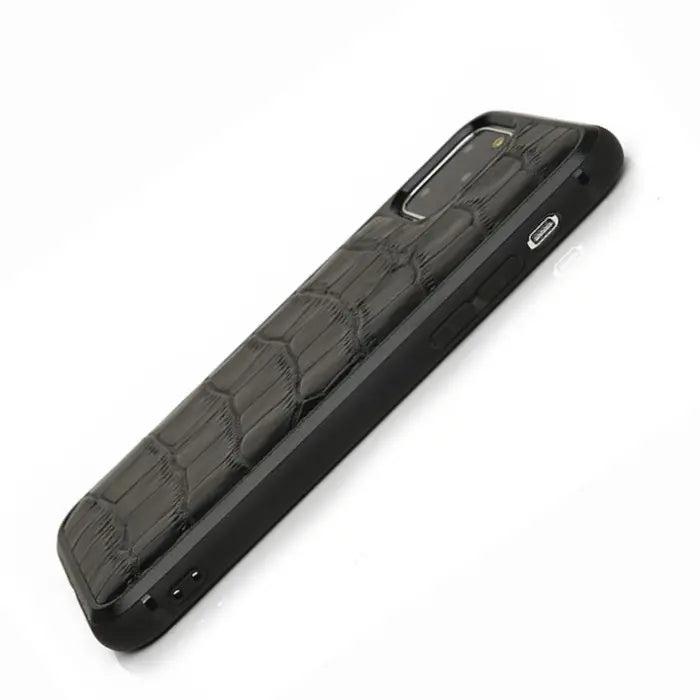 Alligator Skin Phone Case shown from the side with black crocodile texture and button access.