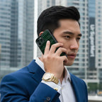 Alligator Skin Phone Case in green held by a man in a suit during a business call.