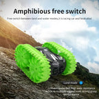 amphibious rc car in land mode climbing a steep hillside, green tracks and black body show strong traction for rugged play