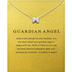 Angel wing necklace in silver displayed on guardian angel meaning card, offering symbolic jewelry ideal for gifting comfort or inspiration