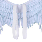 Angel wings closeup showing white elastic shoulder straps and soft textured feather pattern.