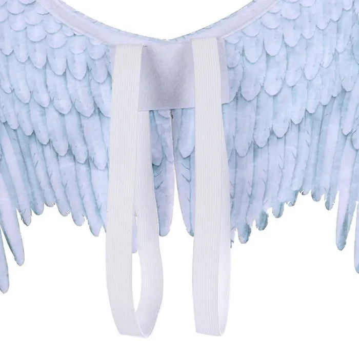 Angel wings closeup showing white elastic shoulder straps and soft textured feather pattern.