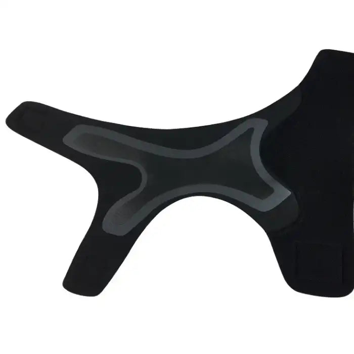 Ankle brace laid flat showing interior grip zones and hook-and-loop fasteners.