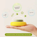 anti-bacterial fruit storage box with airtight lid and space-saving design, shown in a hand