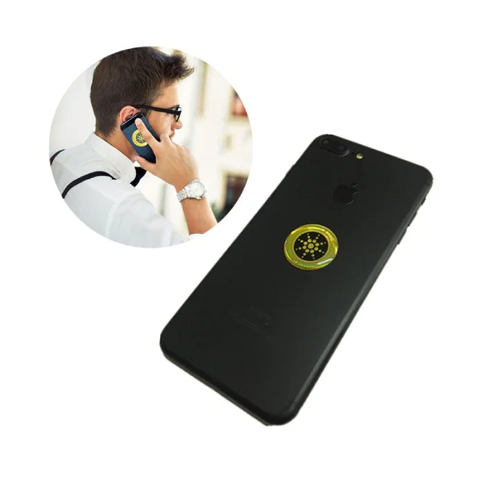 Anti radiation sticker centered on flat matte black smartphone with clean white background.