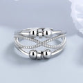 Anxiety relief ring with smooth spinning beads and detailed textured bands, offering stylish calming stress relief for everyday wear