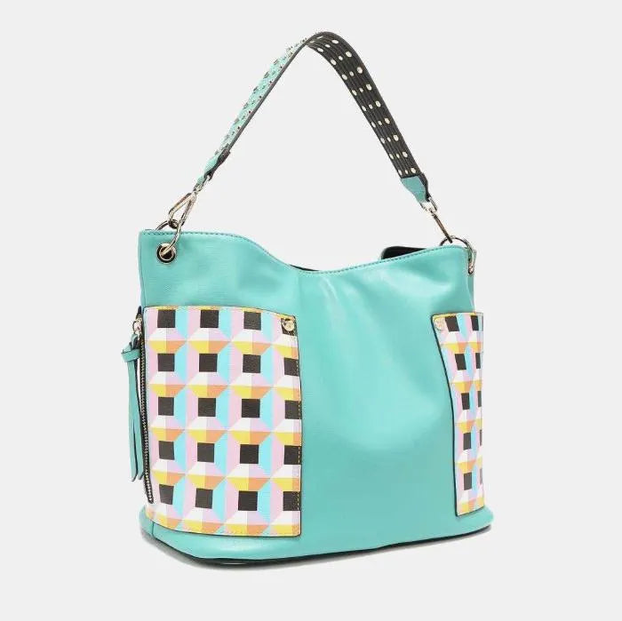 Designer aqua tote featuring pastel geometric side panels, spotted strap design, and metallic accents