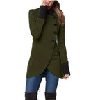 Army green asymmetric wrap coat with black cuff detail, styled casually with denim and tall boots.