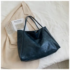 Autumn Shoulder bag in matte navy blue leather with soft structure and gold snap button
