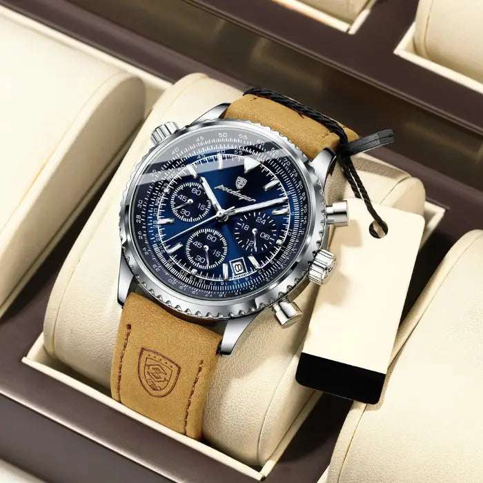 Aviation-style chronograph watch with a blue dial and leather strap, featuring a multi-function display.