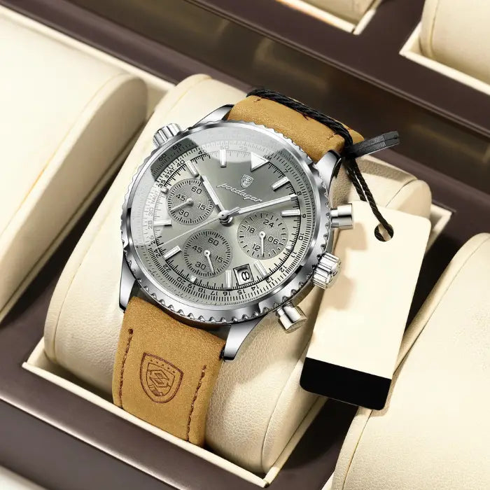 Silver dial aviation-style chronograph watch with a leather strap and precision subdials.