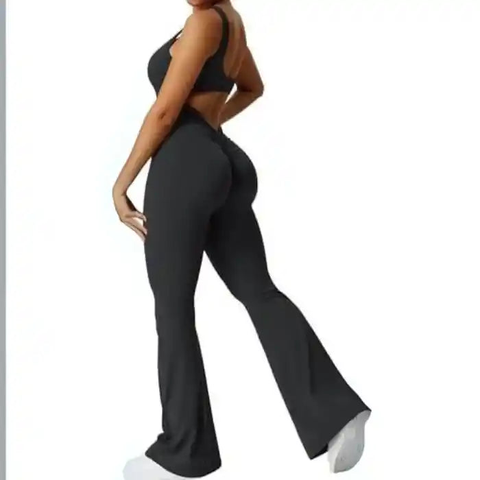 backless flare jumpsuit in black with ruched seam and fitted stretch material
