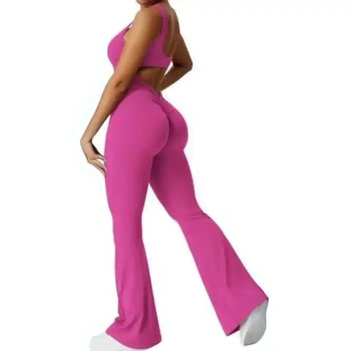backless flare jumpsuit in pink with scrunched seam and snug activewear fit